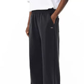 NOAH MARS Logo Embroidered Cross-Shape Micro Flared Pants